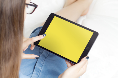 Woman hands using digital tablet. Using for mockup. E-learning concept.の写真素材