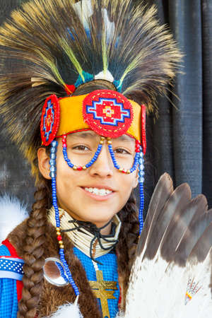 SANTA FE, NEW MEXICO, USA - AUGUST 18, 2013: Santa Fe Indian Market, Teenager, Native American, traditional costume Annual eventのeditorial素材