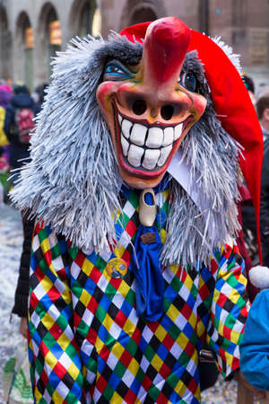 Basel carnival. Gerbergasse, Basel, Switzerland - March 7, 2017. Closeup of a beautiful carnival mask showing a grinning waggis, a typical carnival character.のeditorial素材