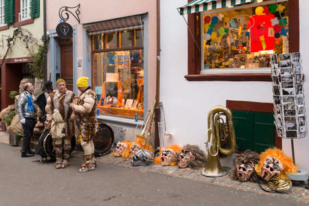 Basel carnival. Nadelberg, Basel, Switzerland - February 21st, 2018. Carnival revelers having a break in the old townのeditorial素材