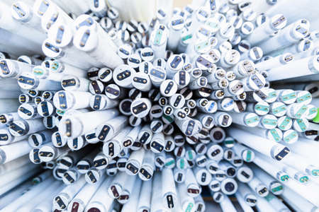 Close-up of a stack of disused and discarded neon lamp tubes waiting for recyclingの写真素材