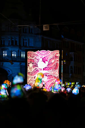 Schifflaende, Basel, Switzerland - March 11th, 2019. Single colorful illuminated main lantern during the carnival morgestraich parade.のeditorial素材