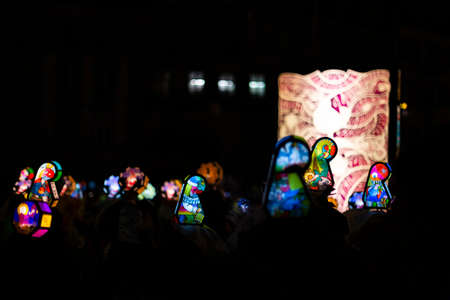 Schifflaende, Basel, Switzerland - March 11th, 2019. Single colorful illuminated main lantern during the carnival morgestraich parade.のeditorial素材