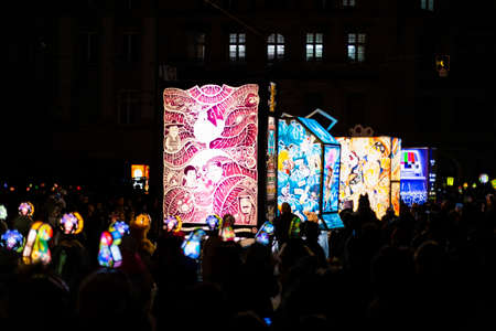 Schifflaende, Basel, Switzerland - March 11th, 2019. Single colorful illuminated main lantern during the carnival morgestraich parade.のeditorial素材