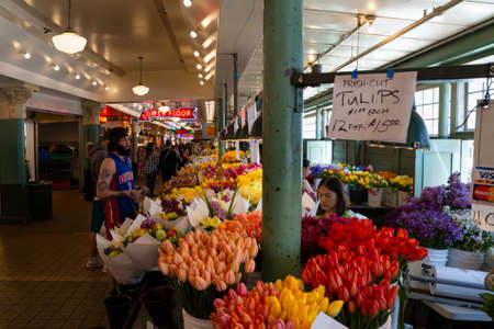 United States of America, USA, Seattle, Washington, Pike Place, May 10th 2019. Display of colorful fresh flowers inside the public market building.のeditorial素材