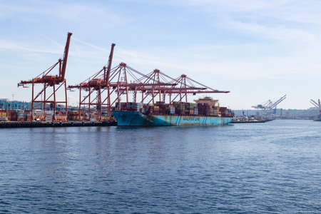 United States of America, USA, Washington, Seattle, 11th of May 2019. View from the water on the commercial port with cranes and a big container ship.のeditorial素材