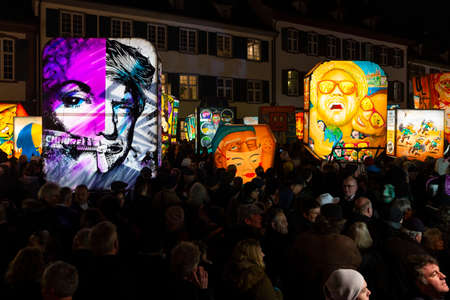 Muensterplatz, Basel, Switzerland - March 12th, 2019. Several hand painted colorful illuminated carnival lanterns displayed on the cathedral squareのeditorial素材