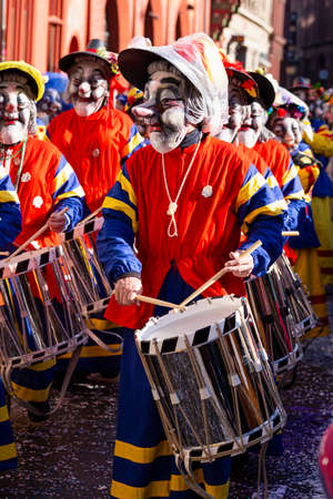 Marktplatz, Basel, Switzerland - March 13th, 2019. Close-up of a carnival participant disguised as an old lady playing snare drumのeditorial素材