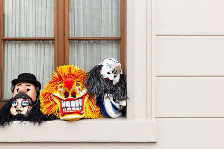 Blumenrain, Basel, Switzerland - March 12th, 2019. Close-up of carnival masks laying on a window...