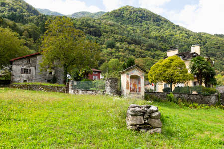 Switzerland, Aurigeno, Sept 2020. Historic holy shrine with colorful madonna paintingのeditorial素材
