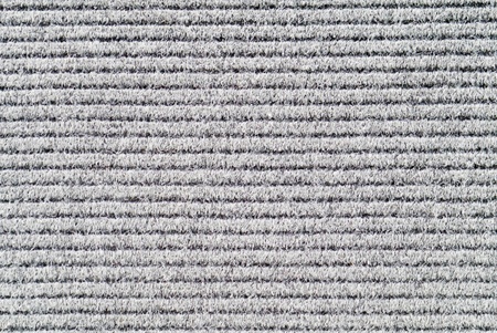 Grey textured background of carpet.
