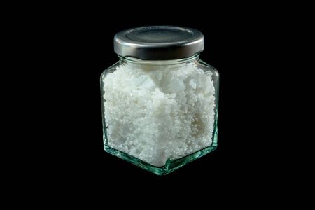 Salt in a bottle isolated on Black background, front view.No peopleの写真素材