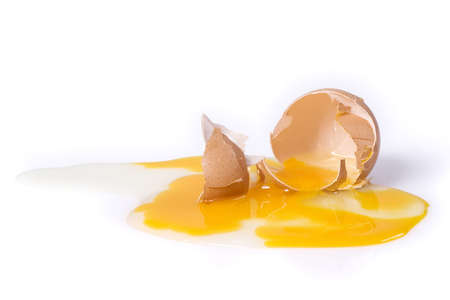 Broken egg isolated over a white background with clipping pathの写真素材