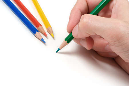 Hand with pencil over a white backgroundの写真素材