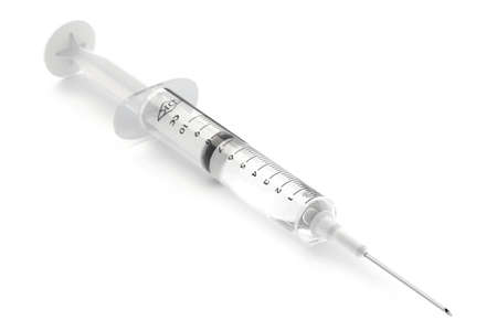 Medical syringe isolated over a white background.の写真素材