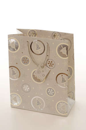Gift paper shopping bag isolated over a white background.の写真素材