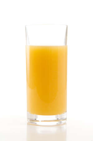 Glass of orange juice isolated over a white background.の写真素材