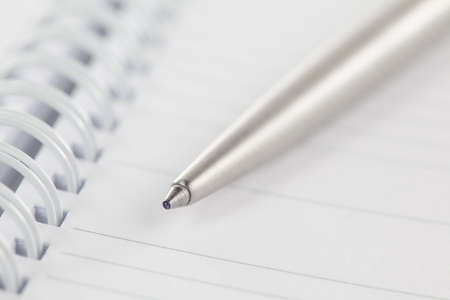 Close-up on an open agenda. Blank page. Shallow depth of field.の写真素材