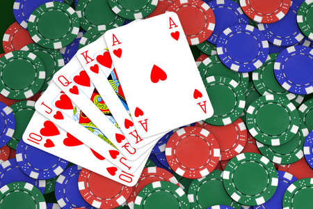 Poker winning hand over a colorful chips background.