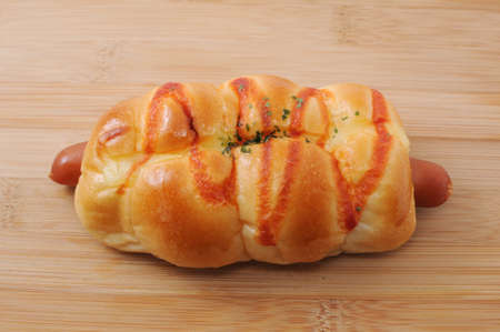bread sausage roll on cutting board