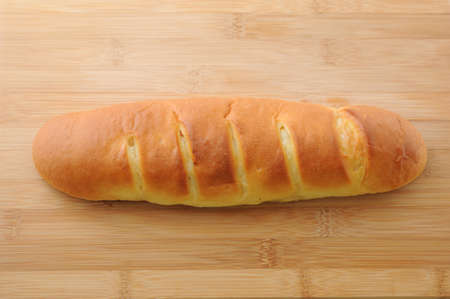 long butter bread isolated on cutting board