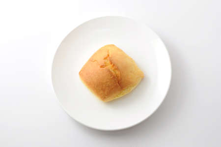 scone on plate on white background