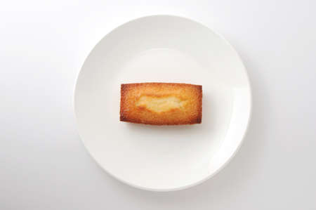 French biscuit Financier on plate isolated on white backgroundの写真素材