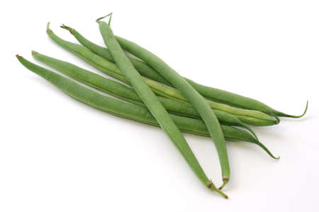 fresh green peas isolated on a white backgroundの写真素材