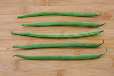 fresh green peas isolated on a cutting board