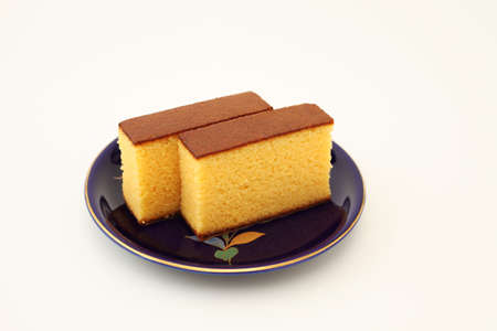castella japanese sponge cake on plate on white background