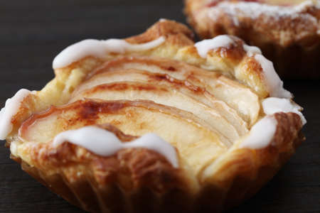 apple pie cinnamon bread isolated on wood tableの写真素材