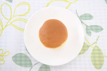 round sponge cake on plate on table