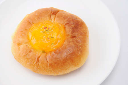 orange marmalade bread on plate on white background