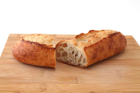 baguette french bread pan isolated on cutting board on white background