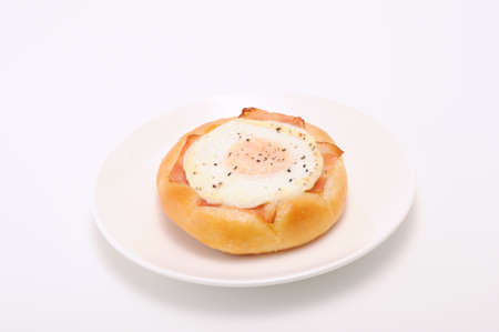bacon egg bread on plate on white background