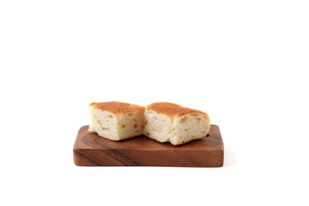 focaccia pizza bread on wooden cutting board isolated on white background