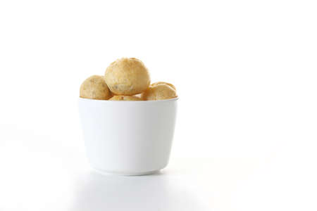 cup of chocolate cream puffs isolated on white background