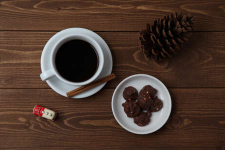 chocolate crunch with hot coffee on wood table