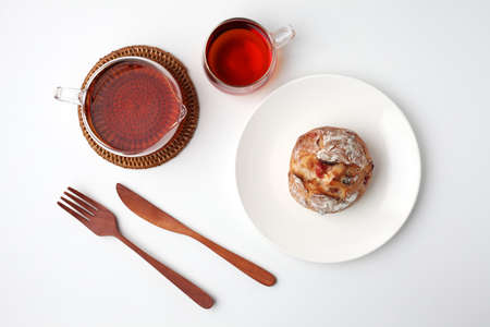 french bread with berries and cheese on plate and tea isolated on white backgroundの写真素材