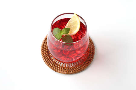 glass of cold tea red drink isolated on white background