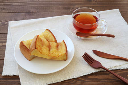 french toast and cup of tea isolated on table