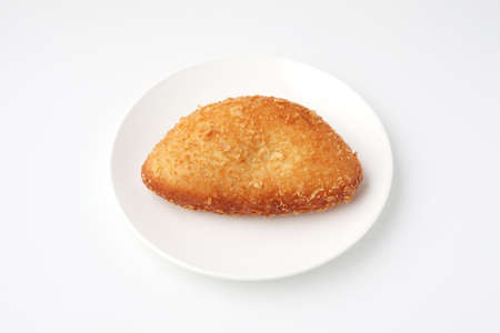 curry bread fried roll closeup isolated on white backgroundの写真素材