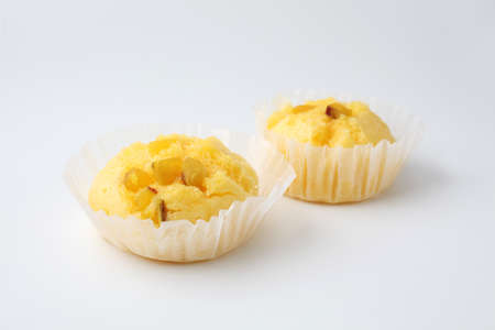 sweet potato steamed bread cupcake muffin closeup isolated on white backgroundの写真素材