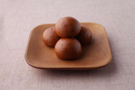 manjyu Japanese traditional confectionery cake wagashi on plate closeup isolated on table
