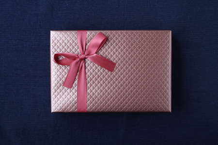 gift present box with ribbon isolated on table cloth