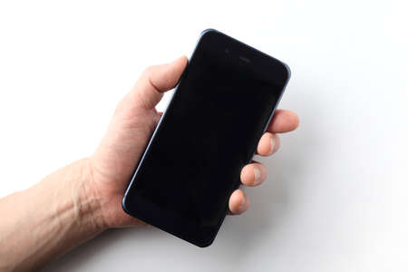 smart phone held in a male hand on white background