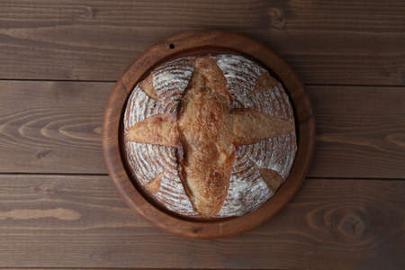 pain de campagne french bread isolated on wooden tableの写真素材