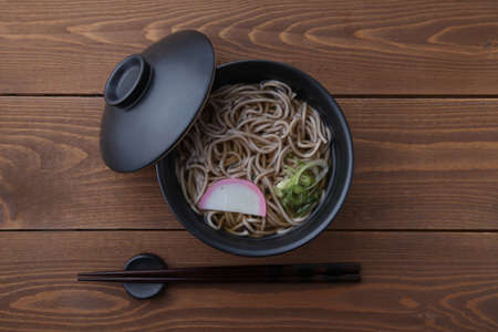 soba buckwheat noodles Japanese isolated on wooden tableの写真素材