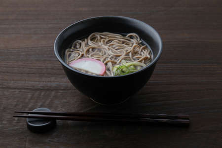 soba buckwheat noodles Japanese isolated on wooden tableの写真素材