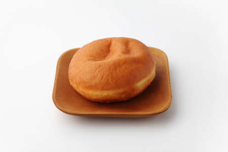 malasada portuguese hawaiian doughnut on plate on white backgroundの写真素材